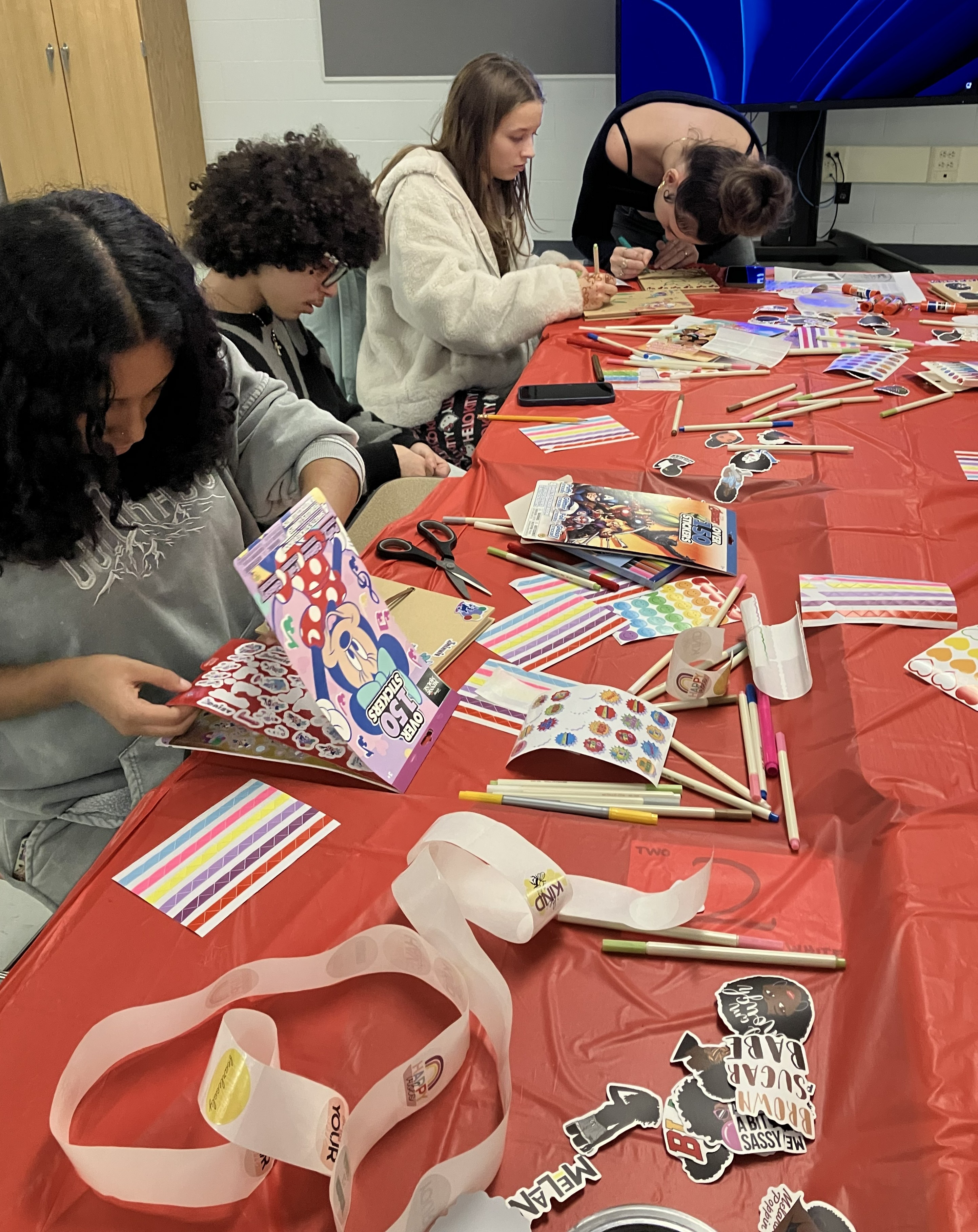 Teens doing arts and crafts at NWBCC after school program