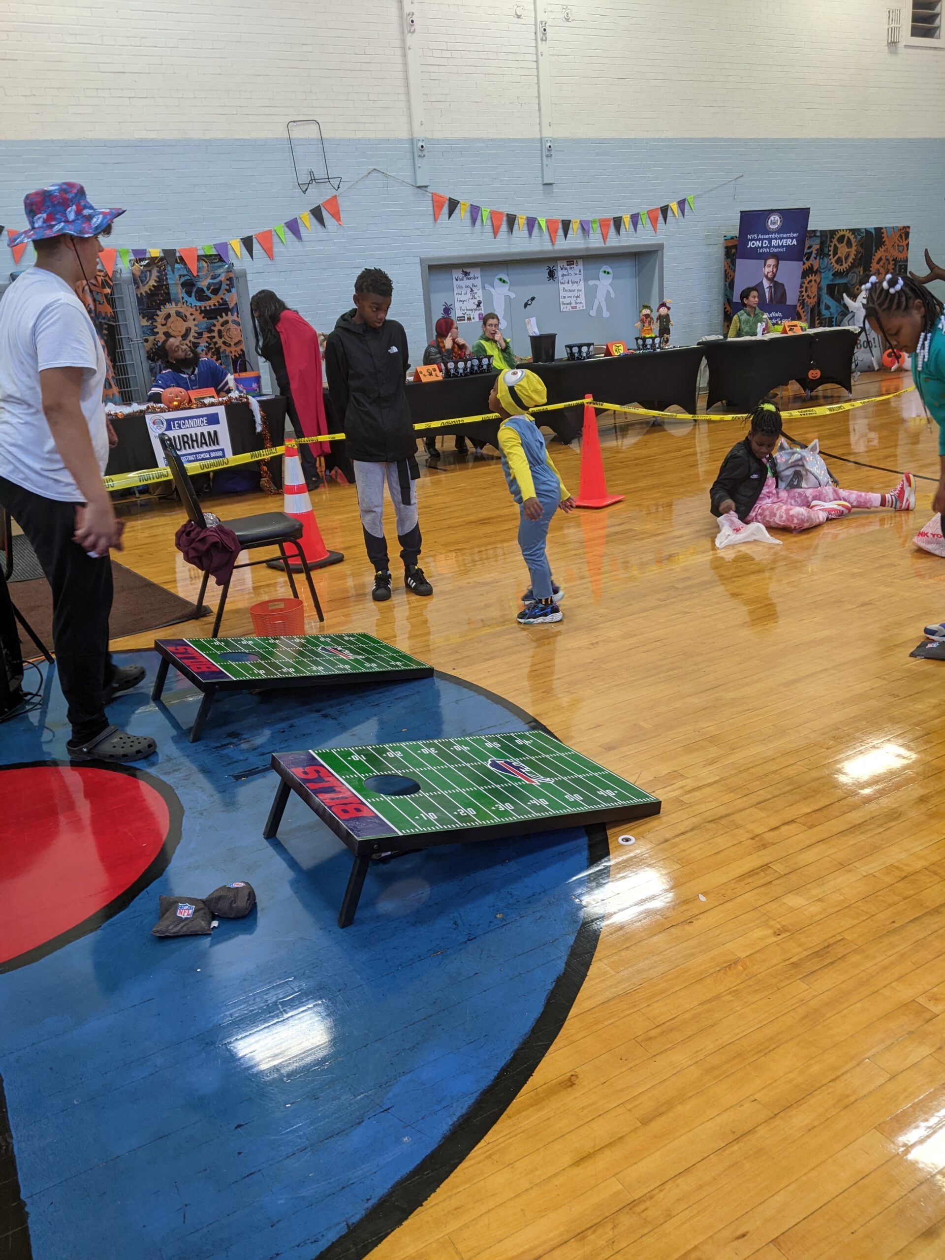 Youth playing interactive games and sports at gym event